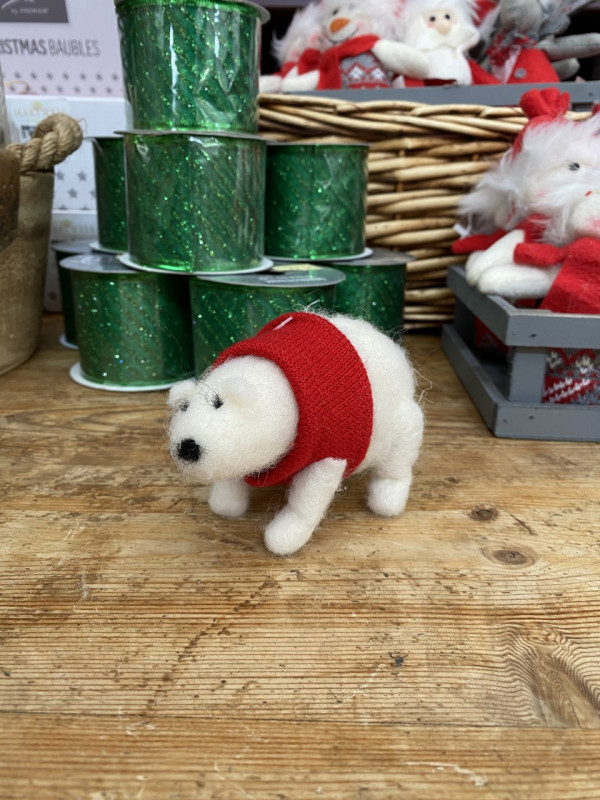 Christmas Polar bear with knitted red jumper photo